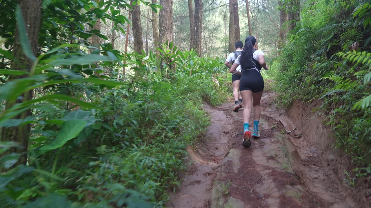 Couple Trail Running in Forest