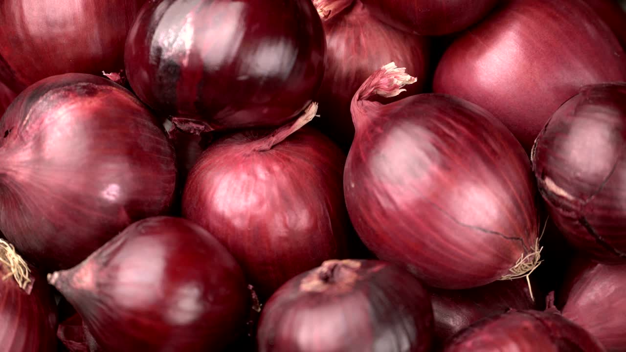 fondo de cebollas rojas giratorias