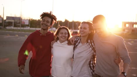 Multiraced-Happy-Friends-Walking-Embracing-Together-In-City