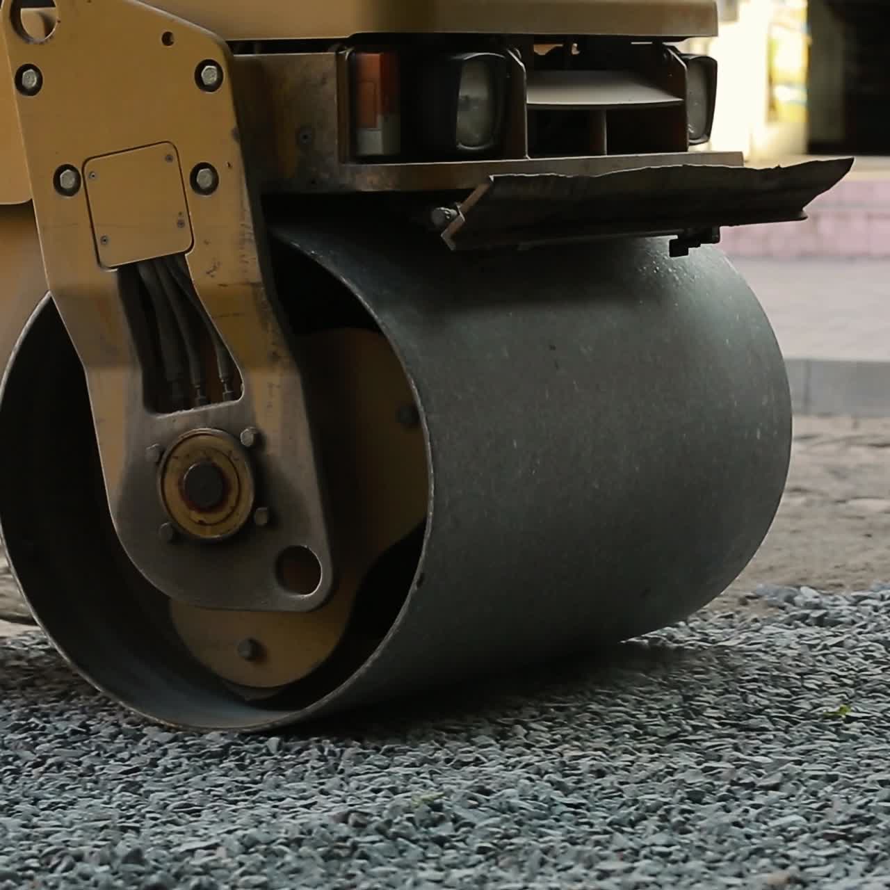 Road Roller Working On A Gravel