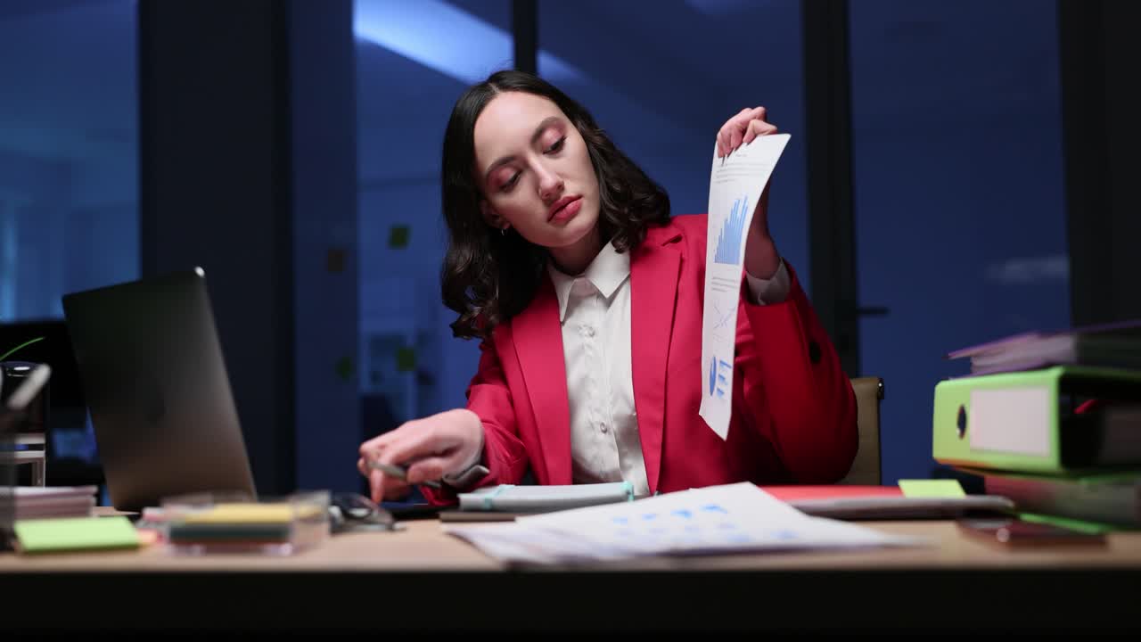 Woman working late at the office