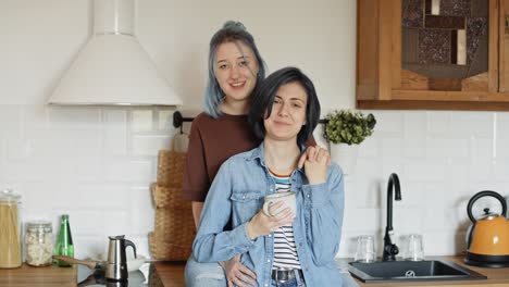 portrait video of happy lesbian couple in the kitchen.