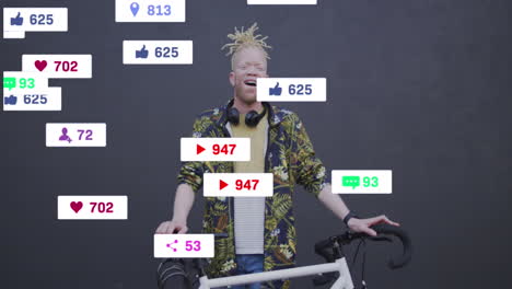 animation of social media icons over african american albino man with bicycle smiling