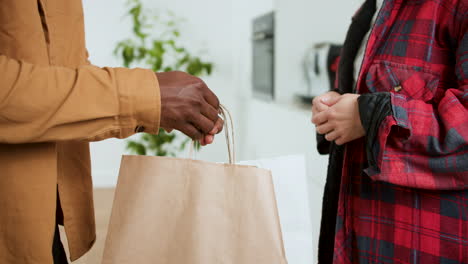 man receiving food delivery