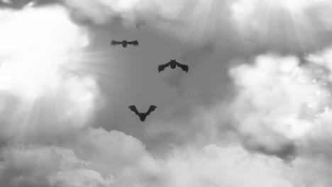 murciélagos de halloween volando con el cielo nublado