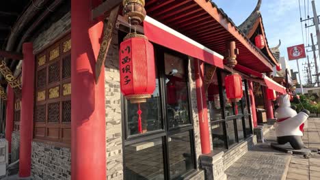 a walk through a chinese temple with red lanterns