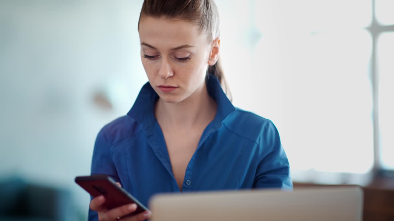 Woman Working on Laptop and Mobile Phone