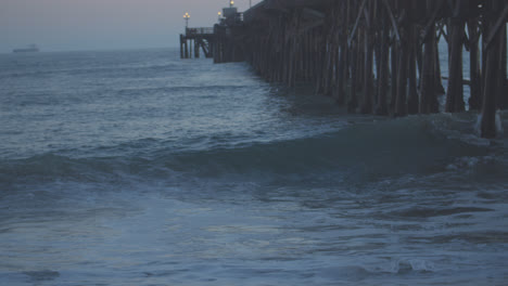 massive waves under the seal beach pier