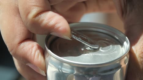 opening a can of soda