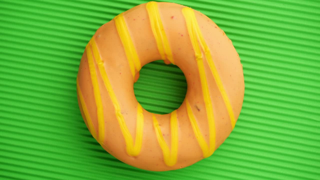 Doughnut glazed close-up. Seamless looping.