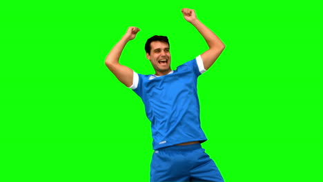 Happy-football-player-gesturing-after-a-goal-on-green-screen