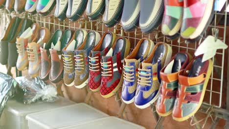 vibrant shoes displayed at bangkok's floating market