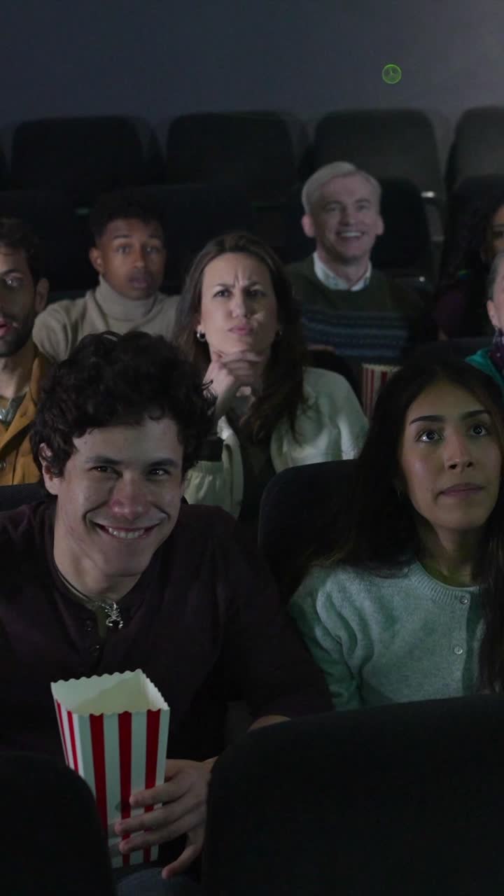 Excited People Enjoying a Movie in a Theater