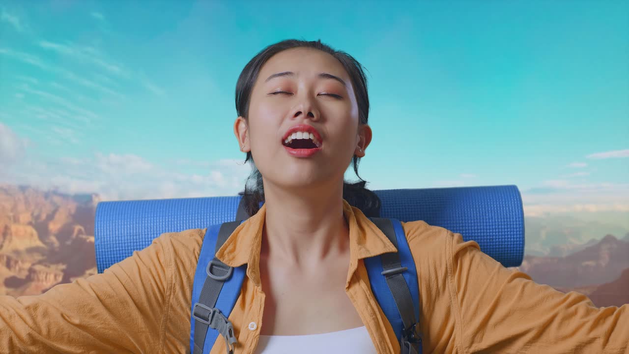 Close Up Of Asian Female Hiker With Mountaineering Backpack Smiling And Spreading Arms Enjoy Looking The View Around While Traveling At The Top Of Mountain