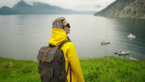 woman hiking by the fjord