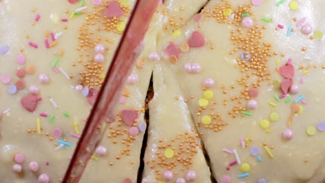 homemade cake cutting with red knife through it