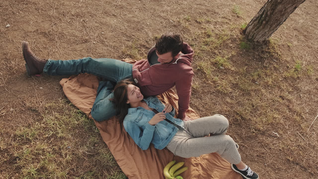 Couple Enjoying a Picnic Outdoors