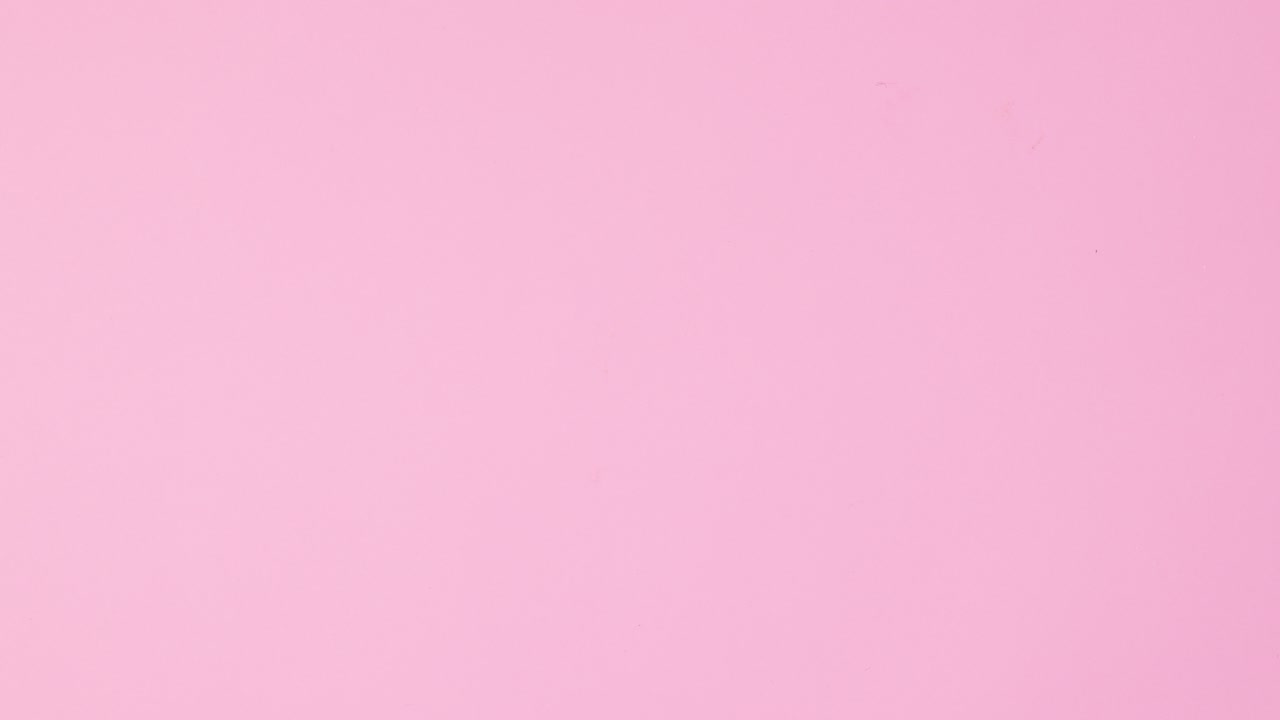 Nail polish bottles appear around color samples on pastel pink background. Stop motion flat lay