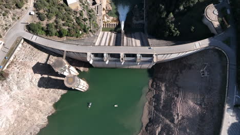 top bird's eye view of large water reservoir dam in catalonia, aerial view