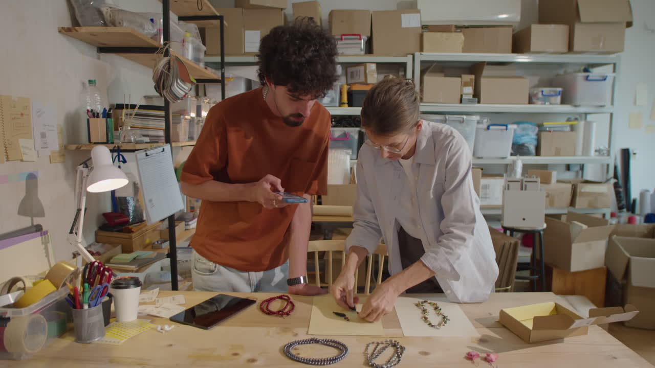 Colleagues Photographing Jewelry for Selling Online