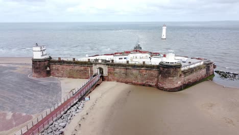 fort perch rock new brighton sandstone coastal defence battery museum aerial rising view with lighthouse