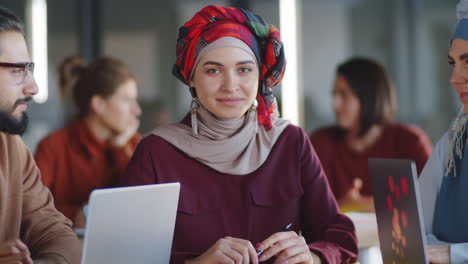 Portrait-of-Young-Muslim-Woman-in-Hijab-at-Business-Meeting