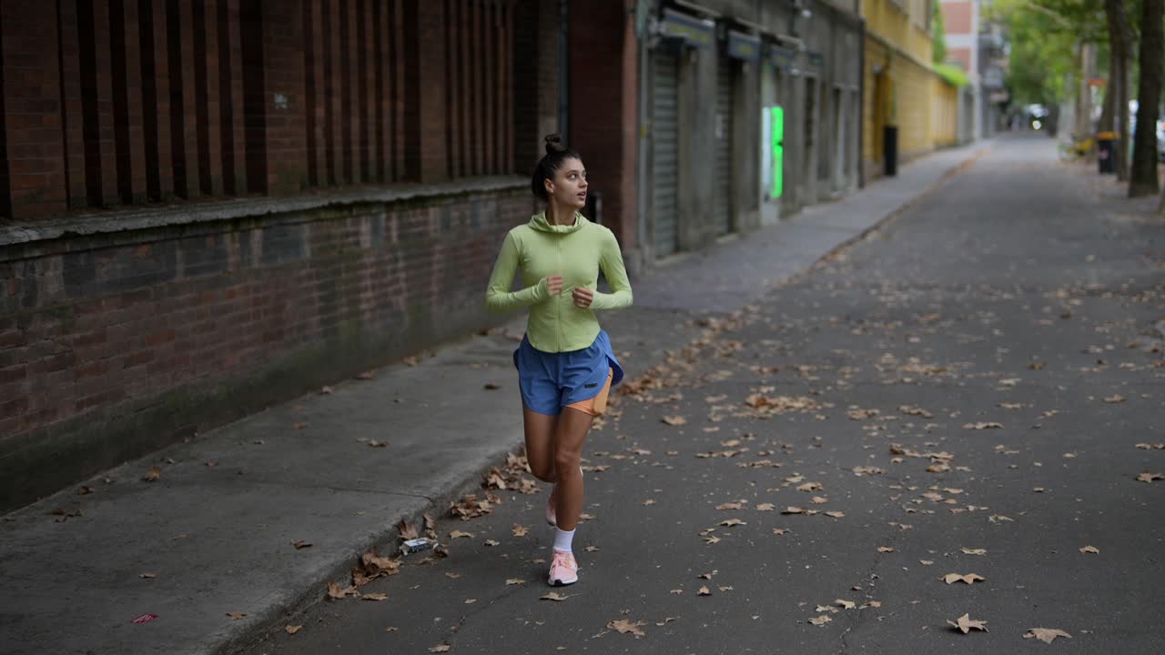 Woman Running Outdoors in the City