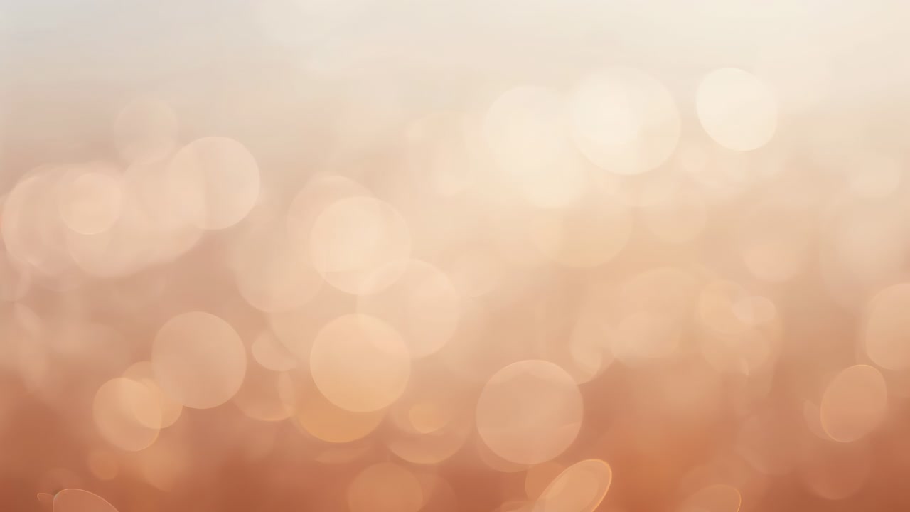 Animation starting, soft bokeh lights shimmering and drifting across warm amber backdrop for decor