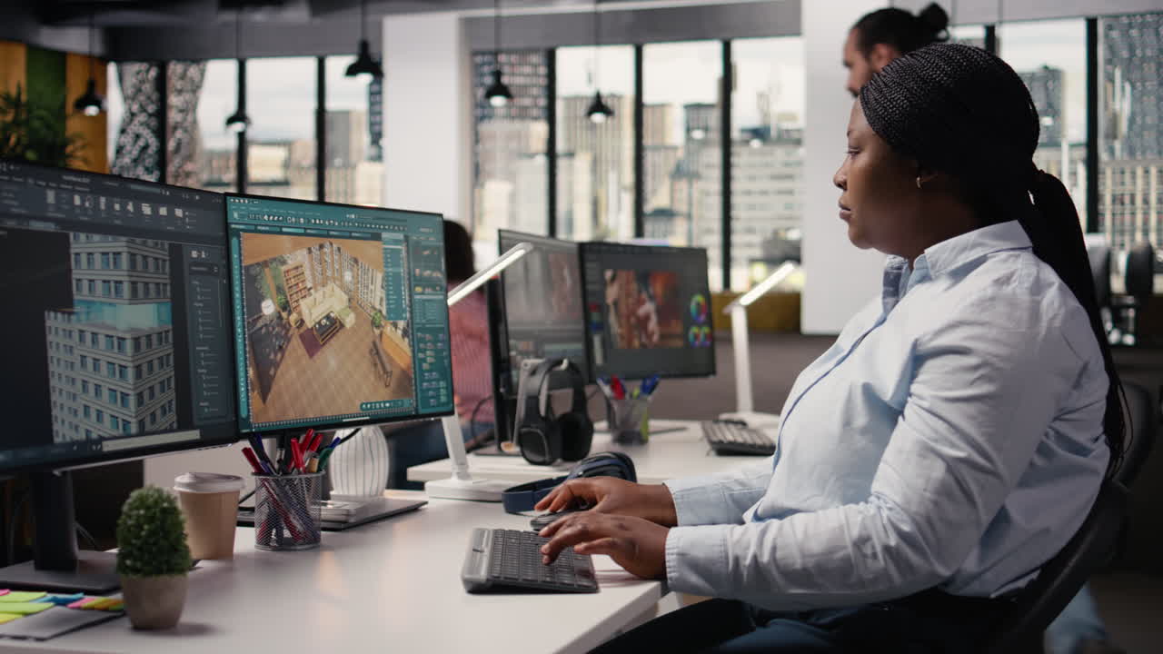 Black female graphic designer using remodeling software for modern floor plan