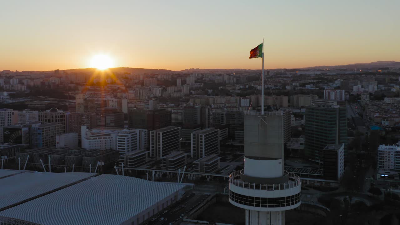 Flying over Parque das Nações in Lisbon.Sunset with Portuguese Flag.