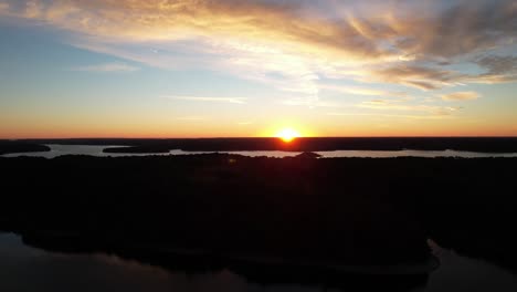 aerial shot of the sun rising over lake monroe in indiana