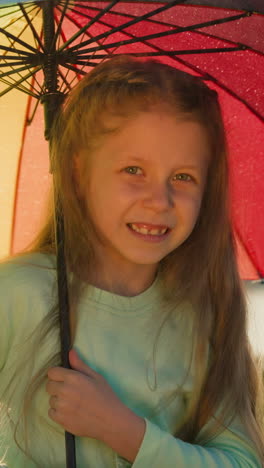 girl shelters by parasol protective cover. child spirit soared untouched by dampness of rain savoring tranquility of riverside retreat. playful twirl