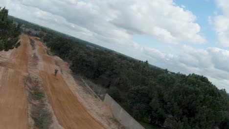 quick aerial pan catches adrenaline junkie jumping getting epic air