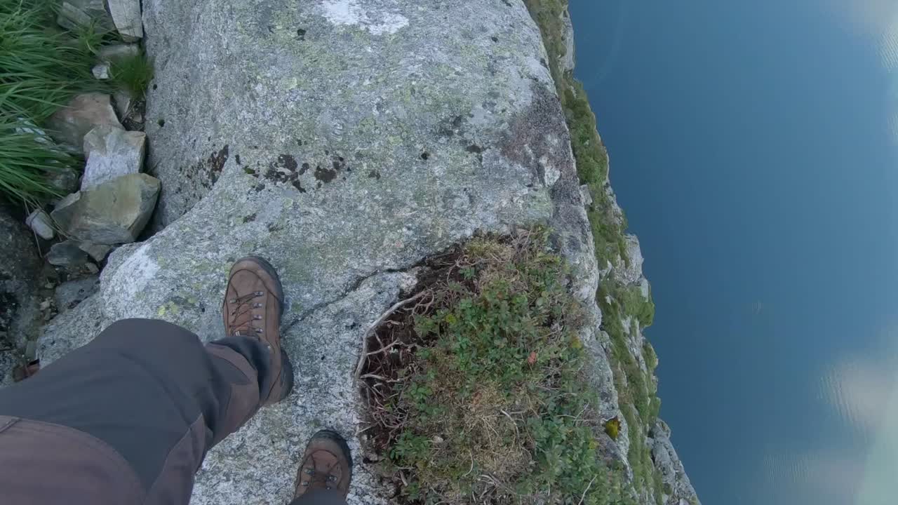 Daredevil walking near a 600-meter drop next to Pulpit Rock, Norway