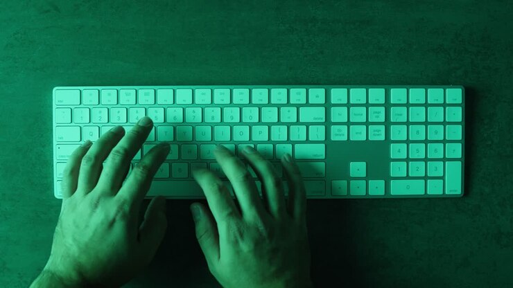 Hands typing on a keyboard