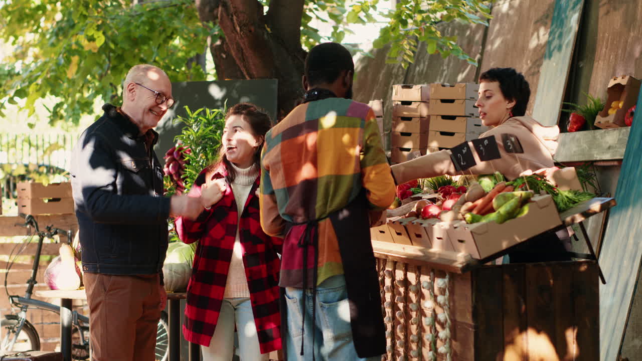 People buying vegetables at a farmer's market