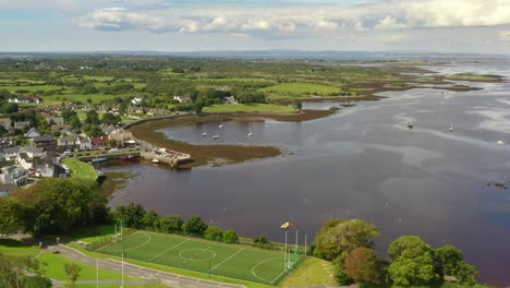 kinvara, galway, ireland, august 2020, drone slowly descending while pushing towards fishing village