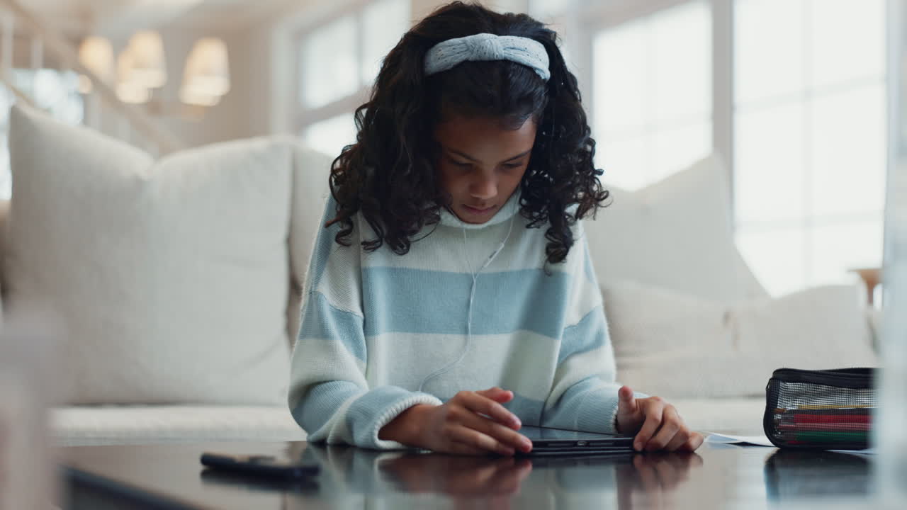 Young Girl Studying on Tablet