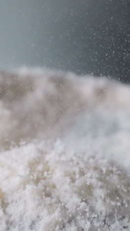 powder-like narcotic substance lies on vibrating surface. cocaine bounces up under influence of electromagnetic field. movement of psychoactive elements macro