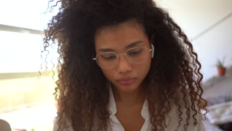 ethnic woman doing paperwork at home