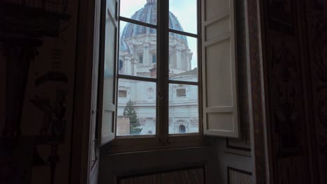 detail shot of st. peter's basilica seen through a window