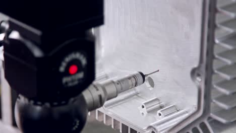 macro footage of a coordinate measuring machine cmm measuring metal part