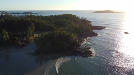 a sunset drone shot of the beaches of tofino on the west coast of vancouver island british columbia canada