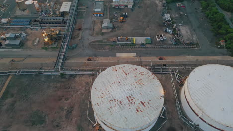 petrochemical plant tanks top view. drone flying over industrial infrastructure