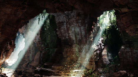 sunlight streaming into a mysterious jungle cave