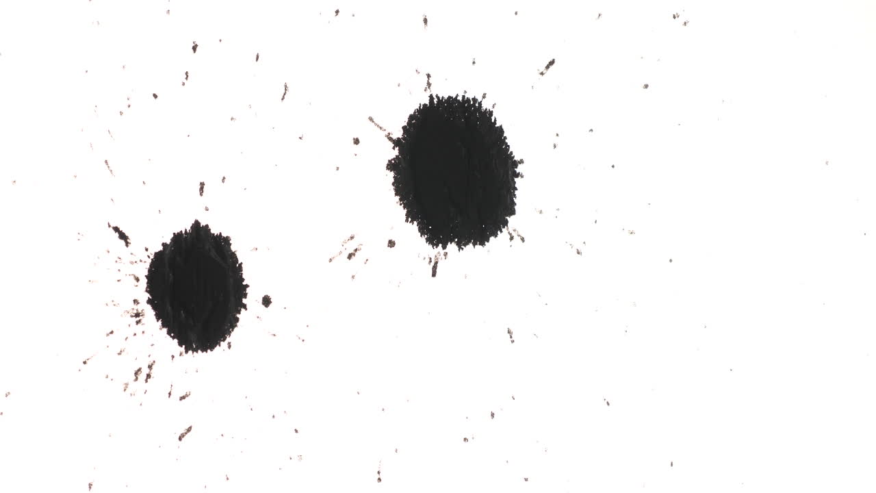 Ink blots on a white surface