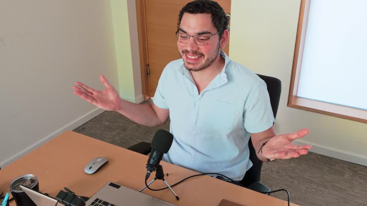 Young Man Presenting at Remote Conference