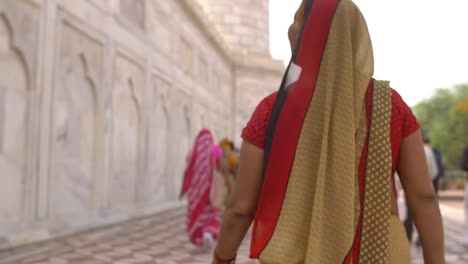 shot following a woman in a sari