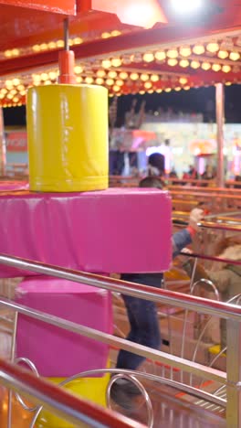 brightly lit carnival ride at night