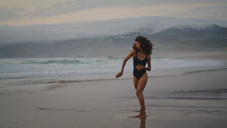 sensual dancer performing beach summer evening. woman dancing contemporary.